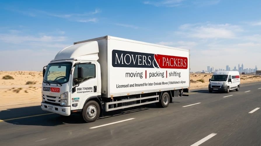 Movers and Packers in UAE branded enclosed moving truck traveling along a UAE inter-emirate highway during a long-distance relocation from Ajman