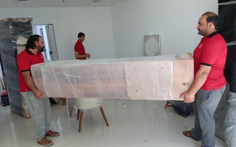 office relocation team in dubai handling office furniture